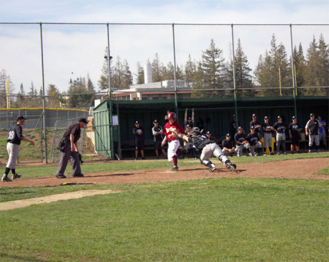 Freshman infielder Johnny Regan (12) scores on a two-run single by sophomore Outfileder Jonathan Collins. This play tied the score 6-6, but the Dons went on to lose the game 19-7 on Saturday March 8.