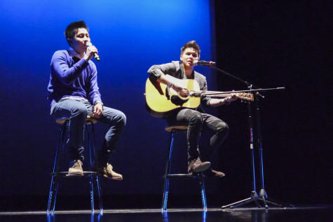 Tan Trat, 21, sings and Duy Vo, 21, performs on the guitar for the event. 